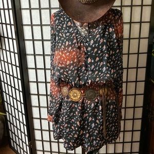 Absolutely stunning romper size medium black rose colored pattern. lightweight.